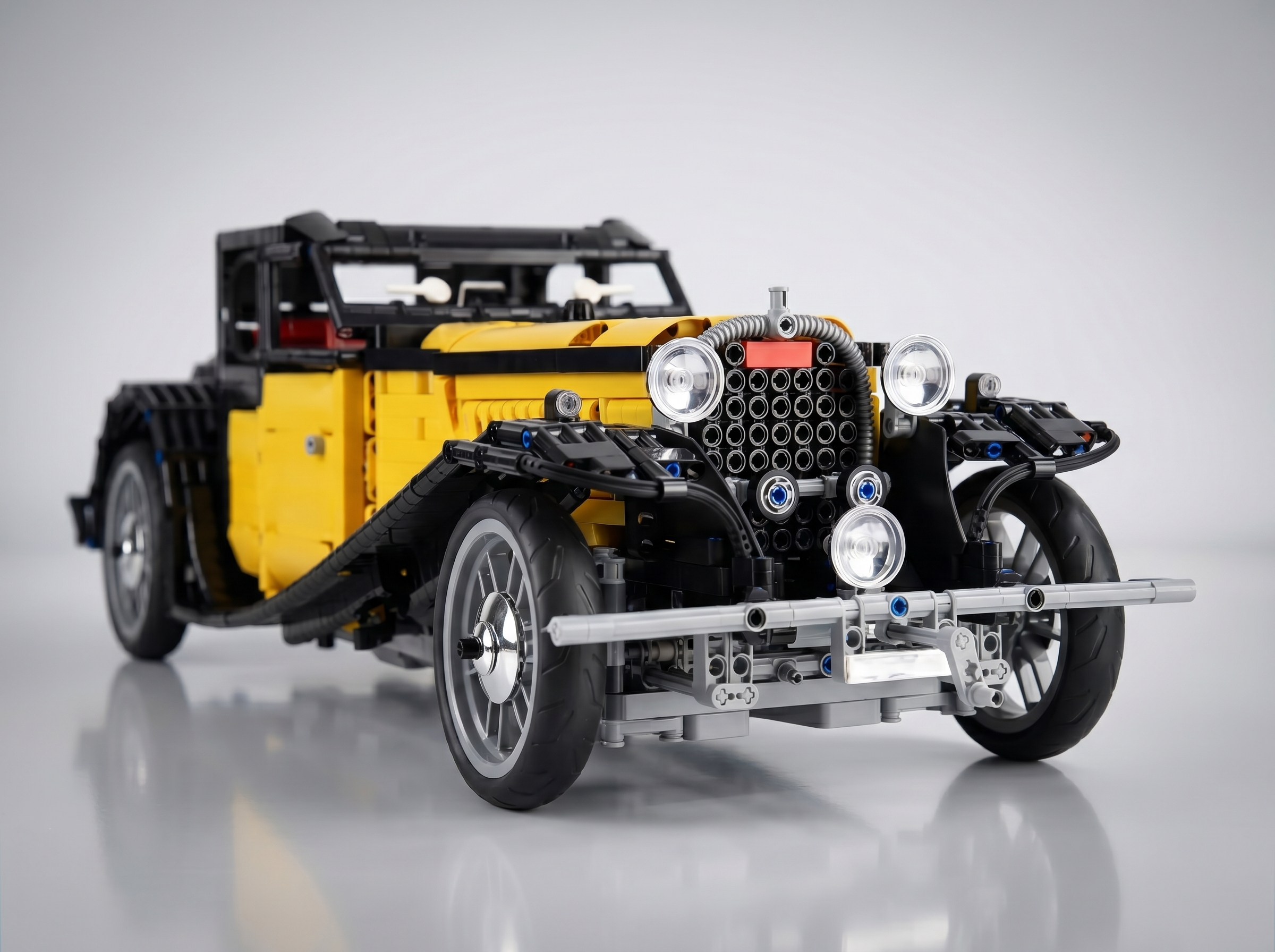 1930s French Grand Tourer brick model front detail, chrome radiator grille and round headlamps