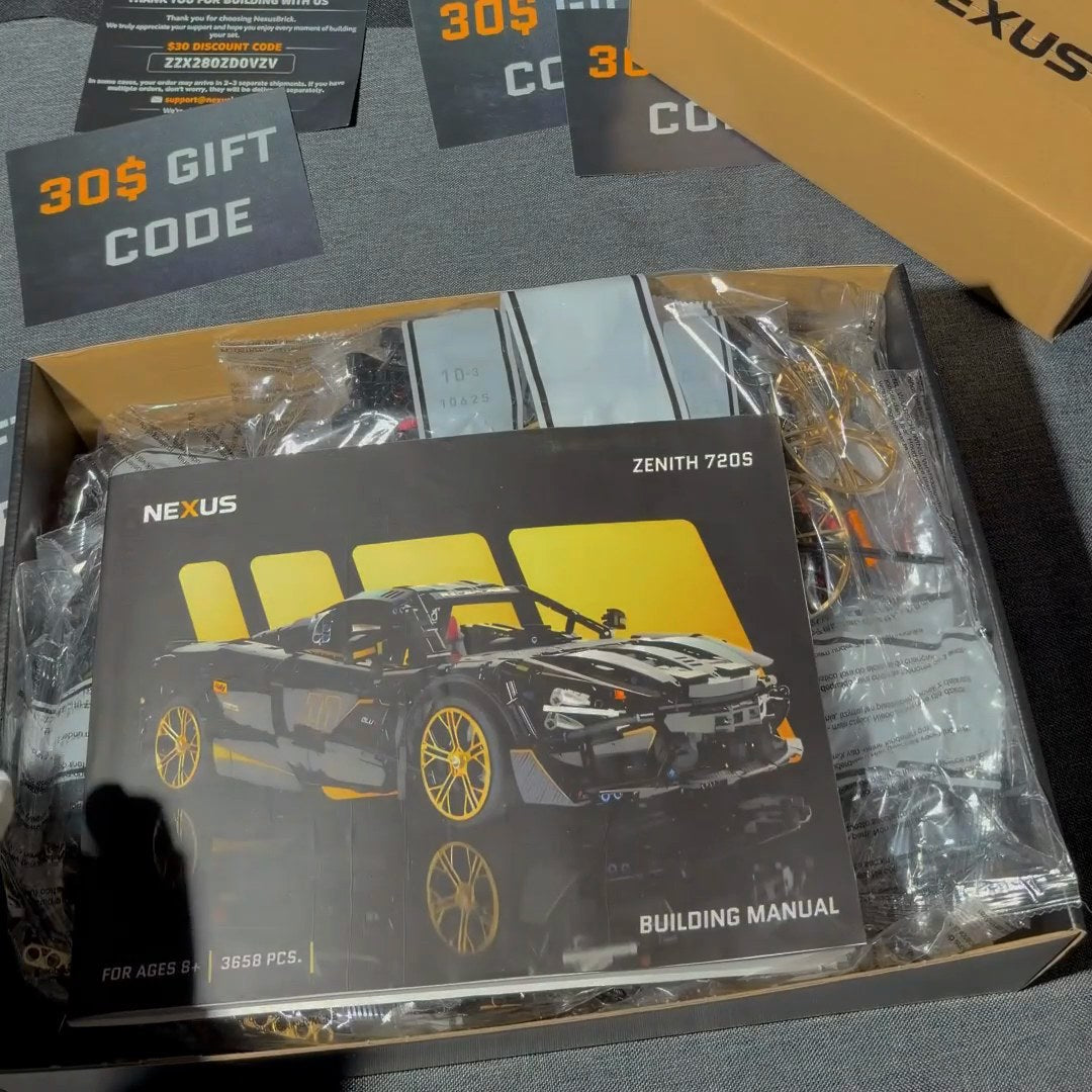 Open Zenith 720S box with the printed building manual on top of sealed, numbered part bags
