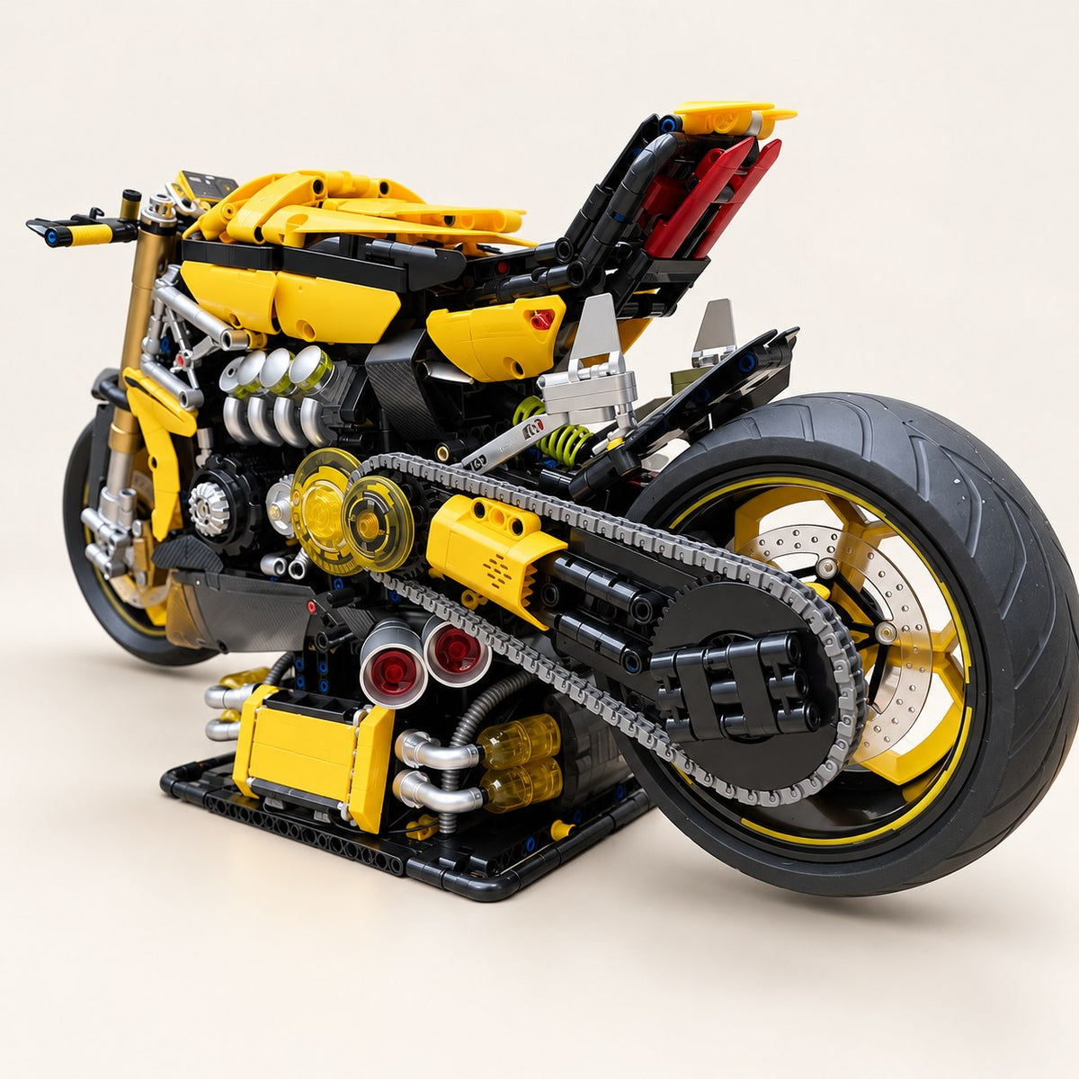 Rear three-quarter view with chain drive and wide rear tyre