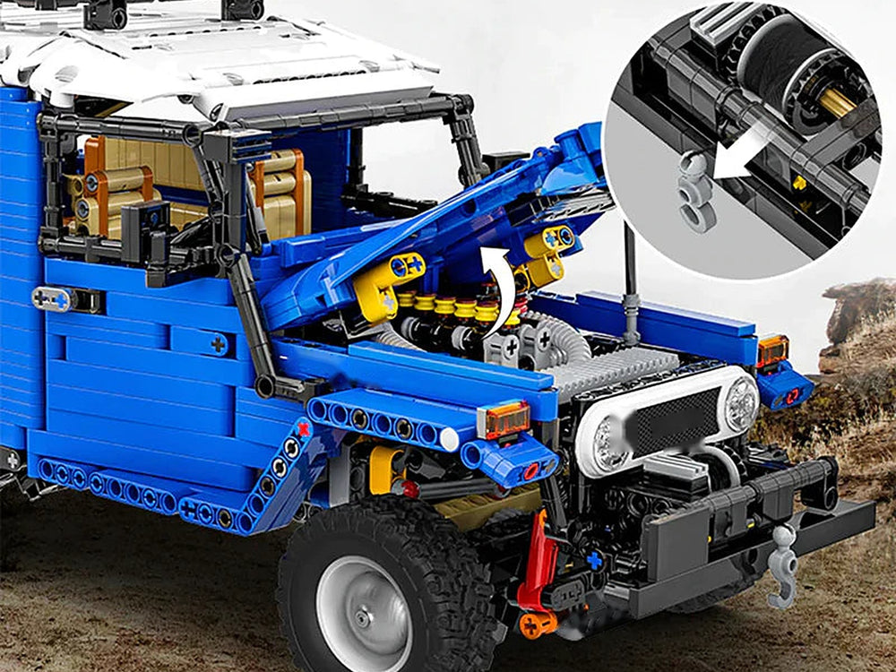 Open hood over the engine, with a close-up of the front winch drum and hook