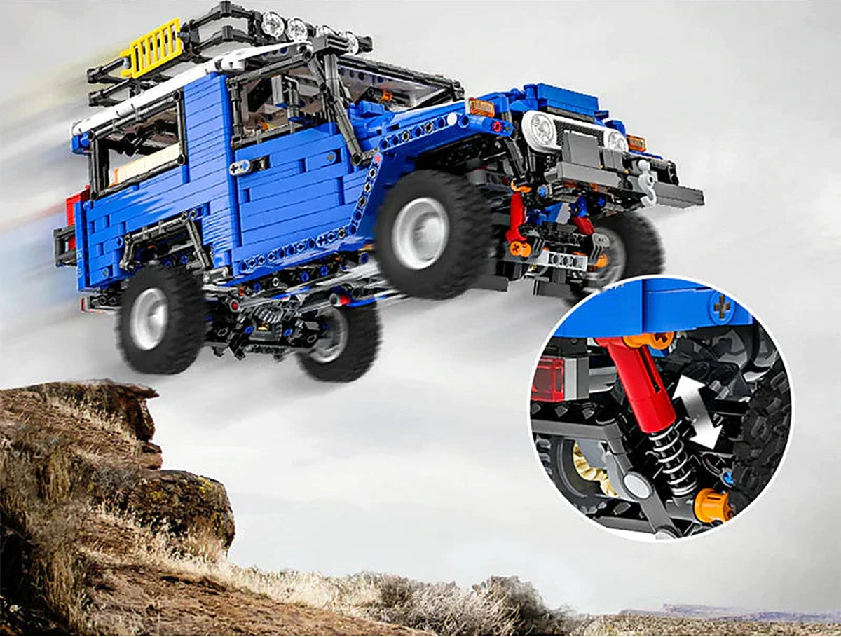 The off-roader in mid-air over a rocky ledge, with a close-up of a rear shock absorber